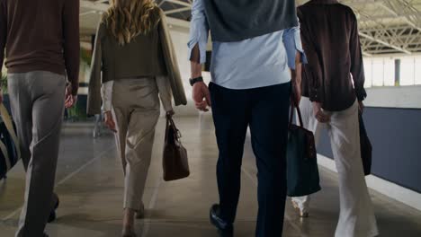 business people walking in a corridor