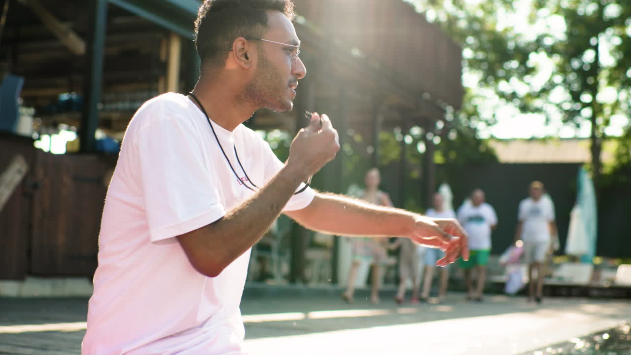 Lifeguard sitting by the pool