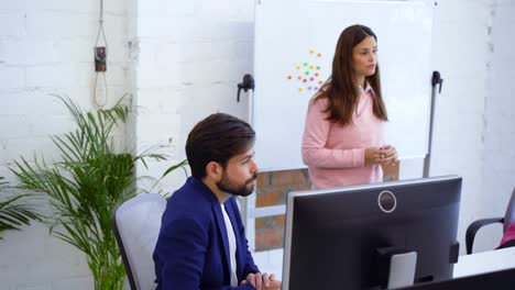 Happy-diverse-coworkers-meeting-in-boardroom