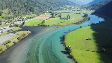 beautiful bend of glacier river in stryn, norway