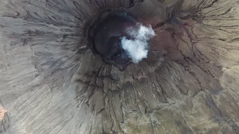 crater with active volcano smoke in east java, indonesia