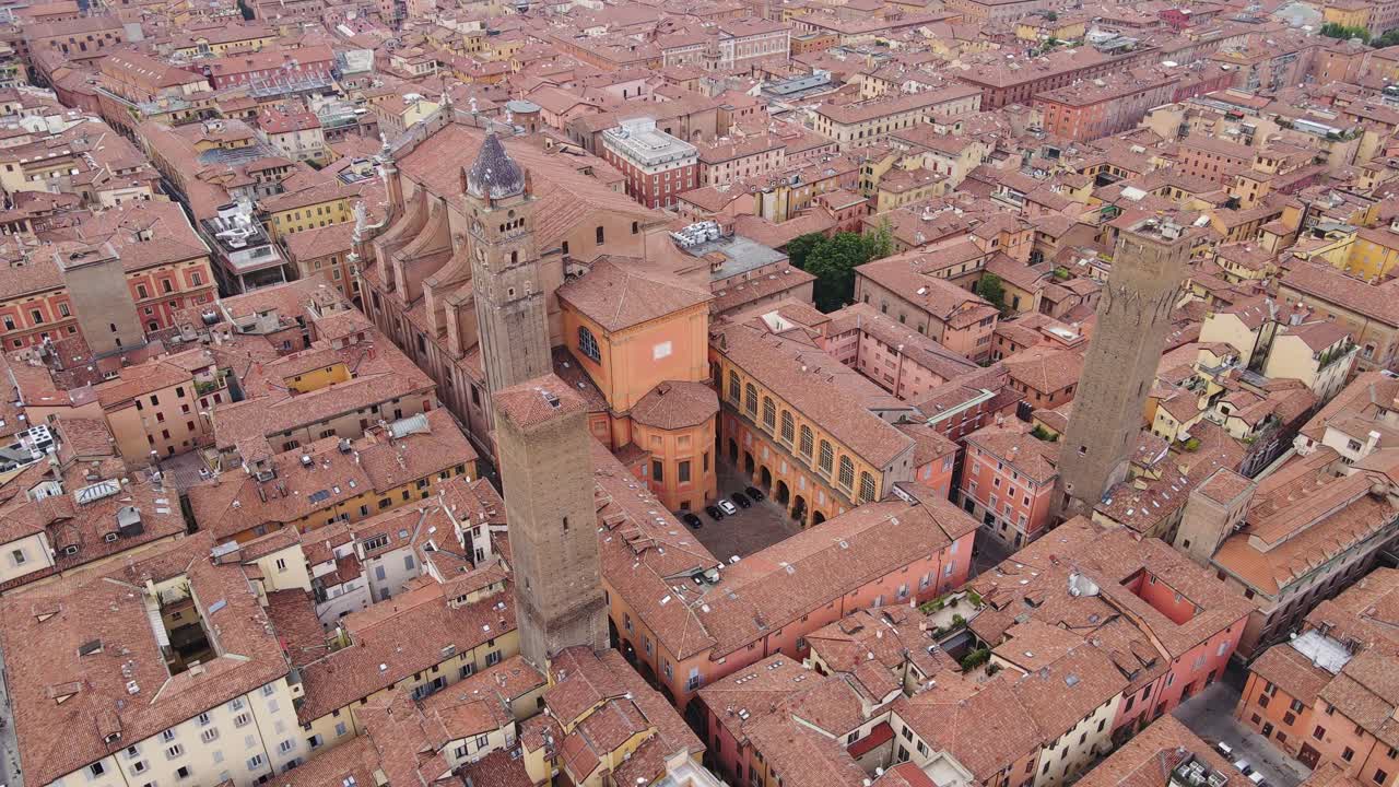 Bologna, iconic medieval towers, vibrant red rooftops, historic cityscape, drone