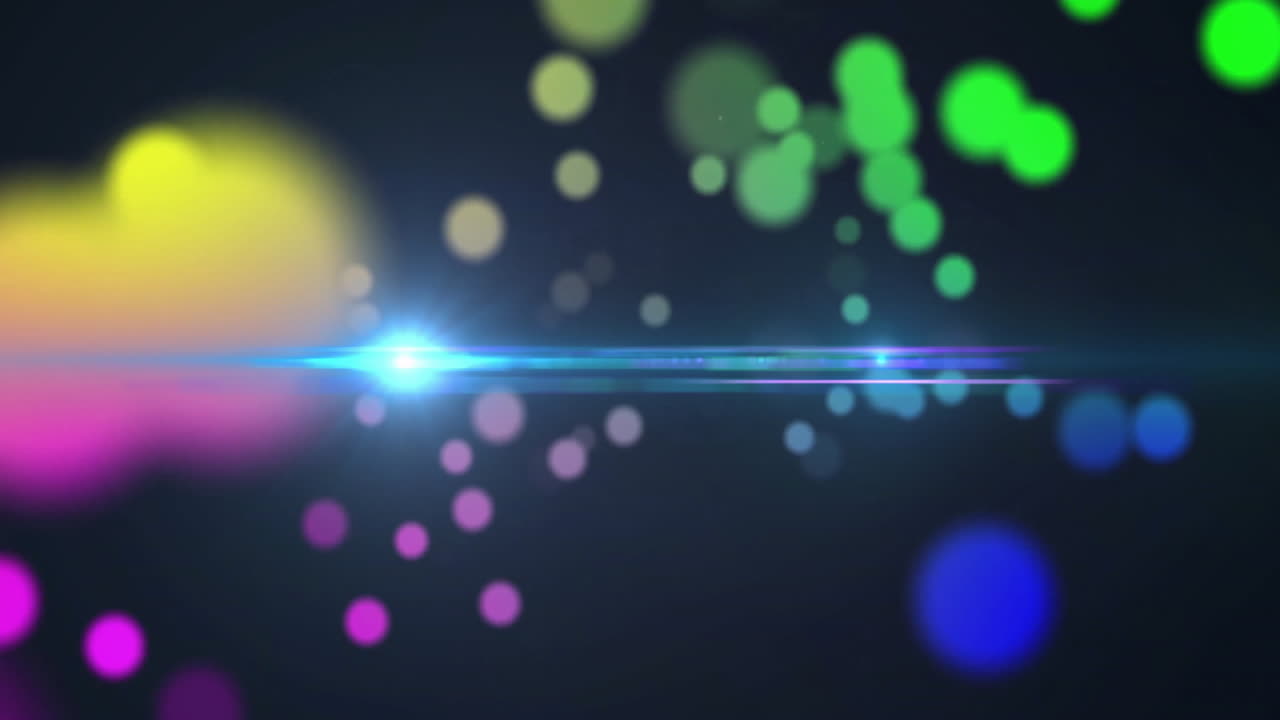 Floating colorful bokeh lights with lens flare effect on dark background