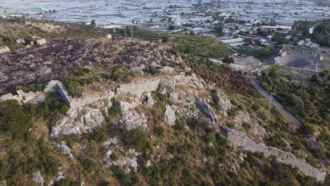 Approaching-drone-shot-over-the-ruins-of-Sillyon,-an-important-fortress-and-city-near-Attaleia-in-Pamphylia,-on-the-southern-coast-of-modern-Turkey