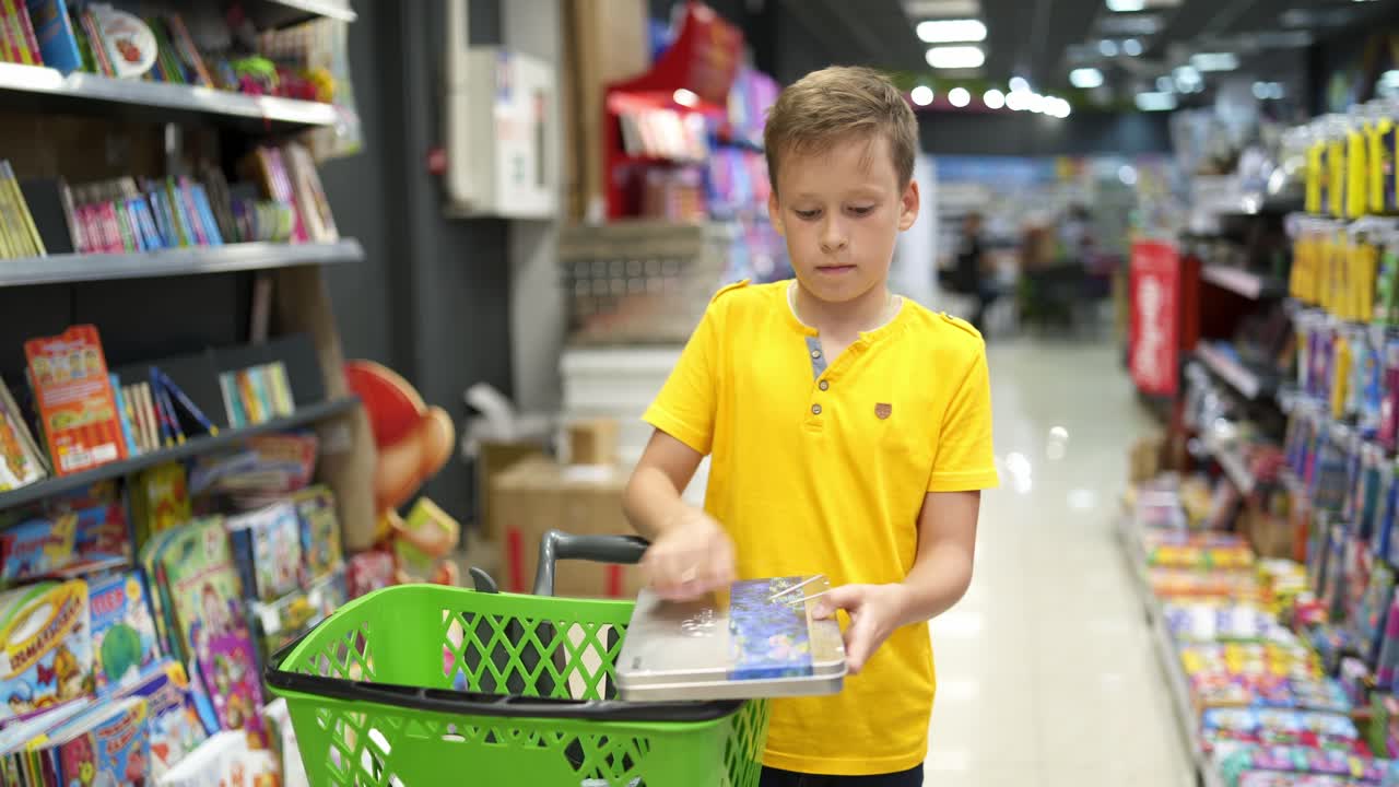 Boy in school store. Schoolboy at store, back to school concept