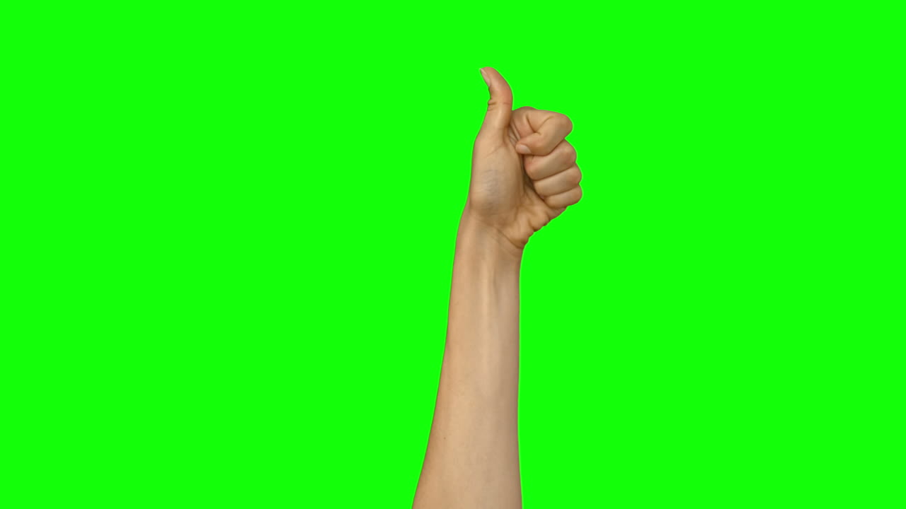 Käsi näyttää peukaloa ylöspäin