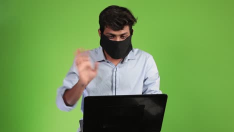 young man succeeding to hack the security data server while working on the computer laptop