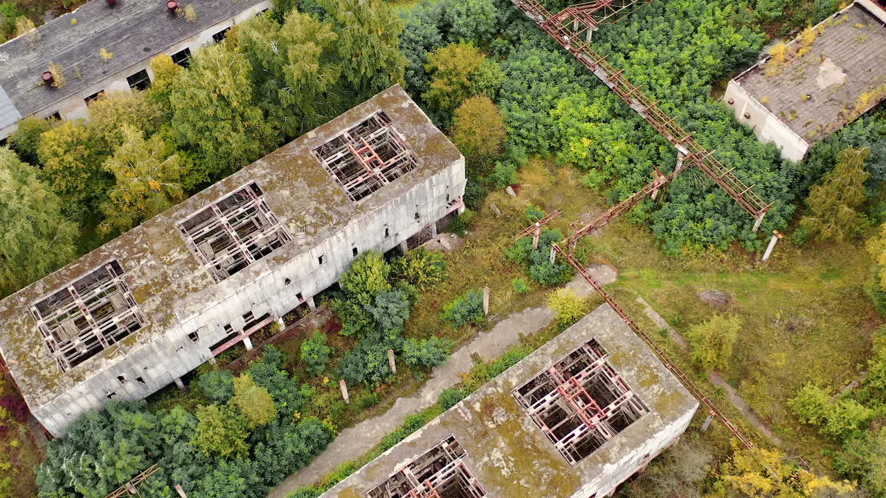 Aerial view of old abandoned factory. Empty destroyed factory buildings on the background.