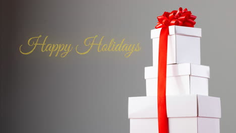 animation of happy holidays text over presents on grey background