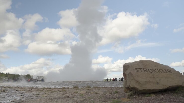 Strokkur geyser eruption, tourists watching, Iceland