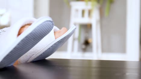 woman's feet in sandals, inside