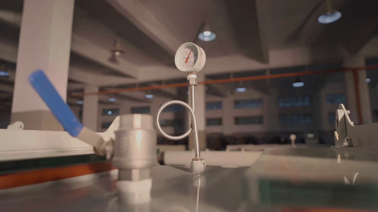 Close-up of Pressure Gauge and Valve on Industrial Equipment