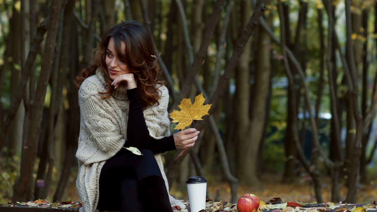 Autumn woman in autumn park. Autumn woman in autumn park. Warm sunny weather. Fall concept