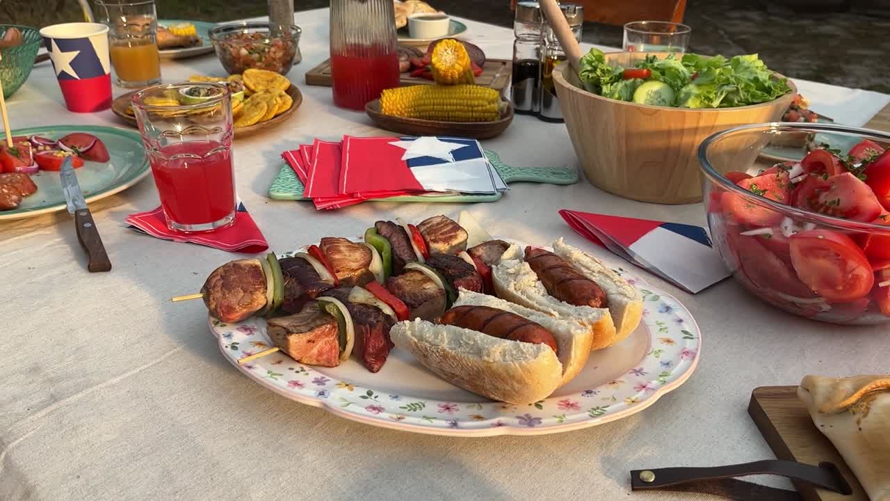 Fiestas Patrias chile grill parrilla meat chorizo table empanadas pebre anticuchos