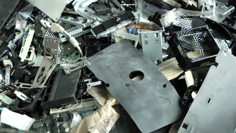 pan on metal parts of electronic waste sorted for recycling