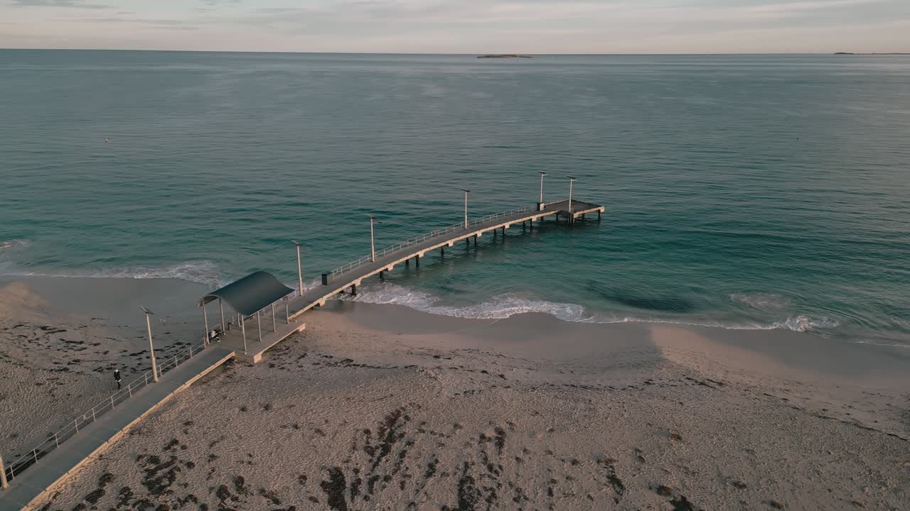 Stunning aerial footage panning around the iconic Jurien Bay Jetty on a winter morning, showing the vastness of the Indian Ocean