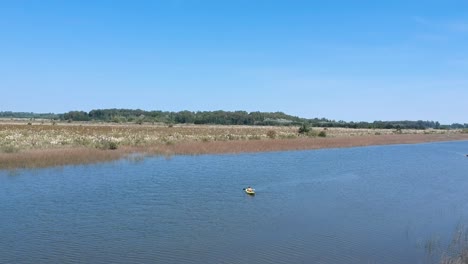 Drone-view-of-sportsmen-kayaking-over-the-recreation-beautiful-vacation-water-stream-in-santa-lucia