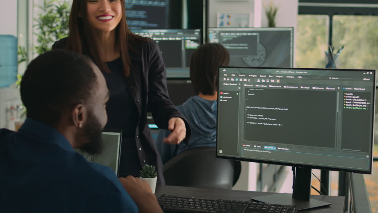 Team of diverse programers doing highfive gesture after coding database