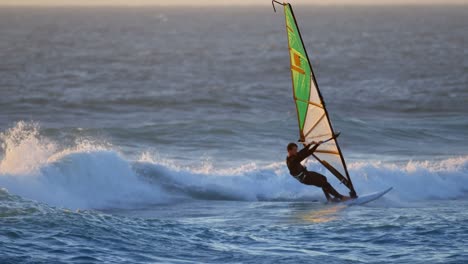 male surfer windsurfing in the beach 4k