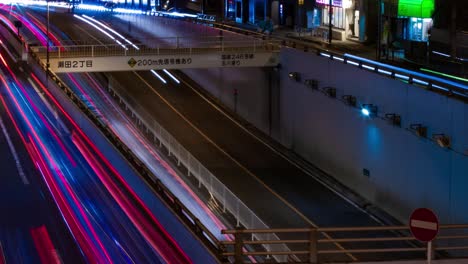 a night timelapse of the traffic jam at the city street in tokyo long shot