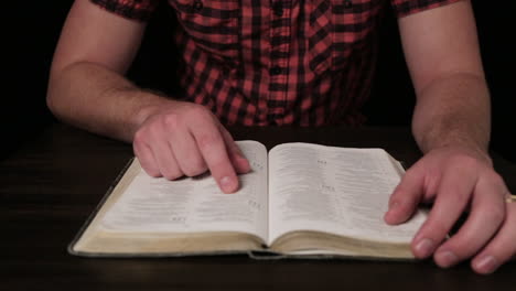 millennial caucasian male reading a bible