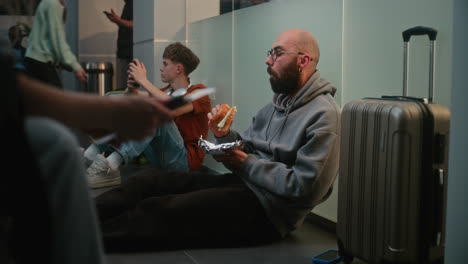 passengers eating in airport lounge