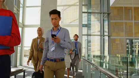 business people walking in office building 4k