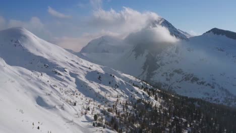 Aerial-view-over-snowy-Rolle-Pass-or-Passo-Rolle,-Italian-Dolomites