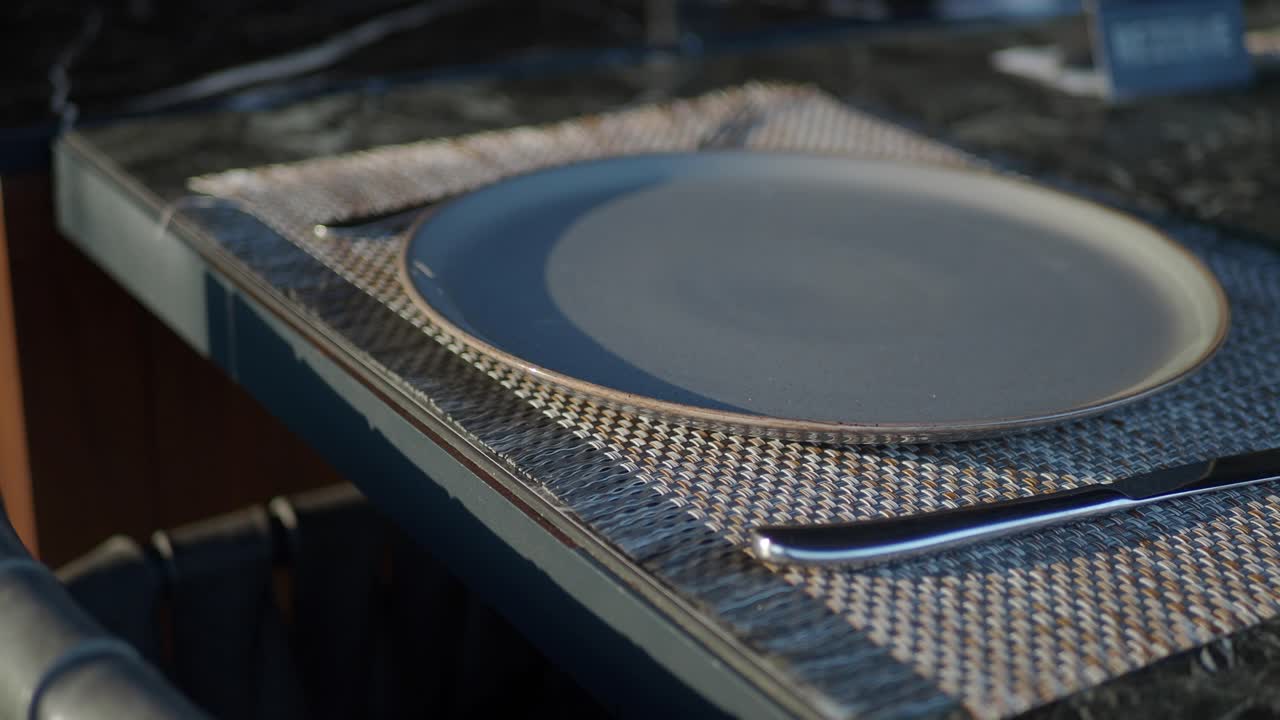 Empty Plate with Knife on Table