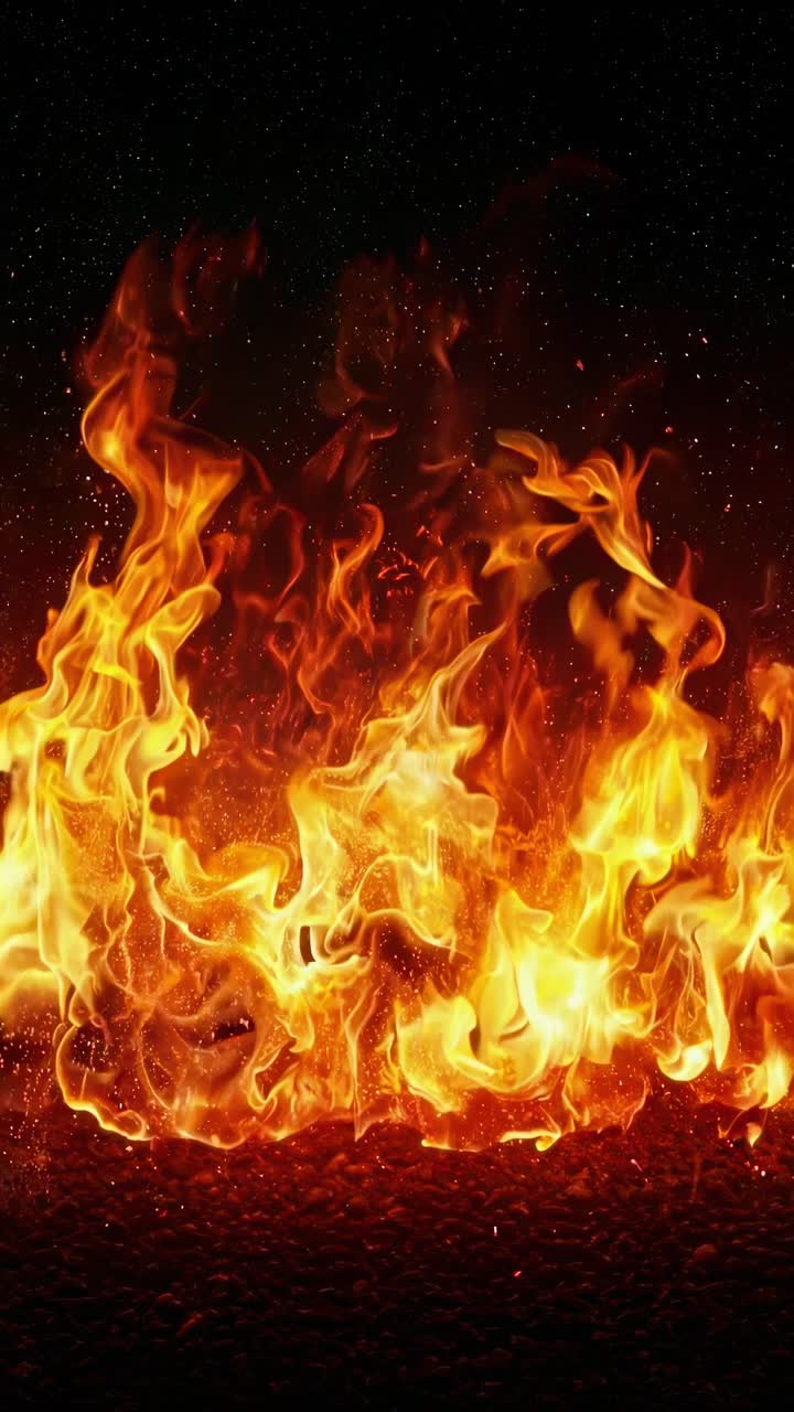 Dynamic video of intense flames shot from a low angle, highlighting the vibrant, fiery textures
