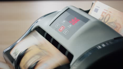 counter machine calculating euro banknotes closeup. equipment for counting bills