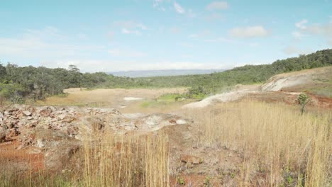 Sulfur-coming-out-of-the-ground-that-has-changed-the-color-of-dirt-and-brush