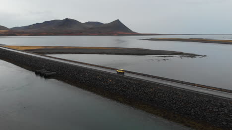 Aerial-View,-Lonely-Car-in-Surreal-Landscape-of-Iceland
