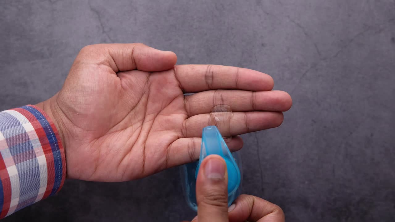 Applying Hand Sanitizer