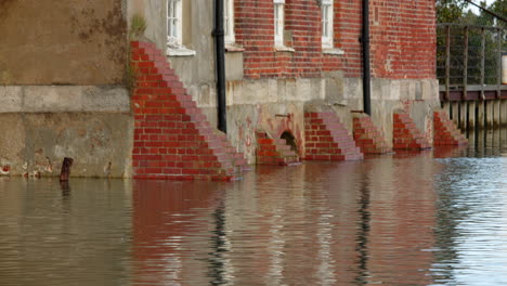 high-tide-flooding-at-Ashlett-creek-watermill-in-the-Solent,-Southampton