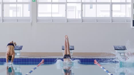 Swimmers-diving-into-the-pool