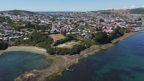 An aerial perspective of Fuerte San Antonio in Ancud, Chiloé Island, showcasing history. pedestal up