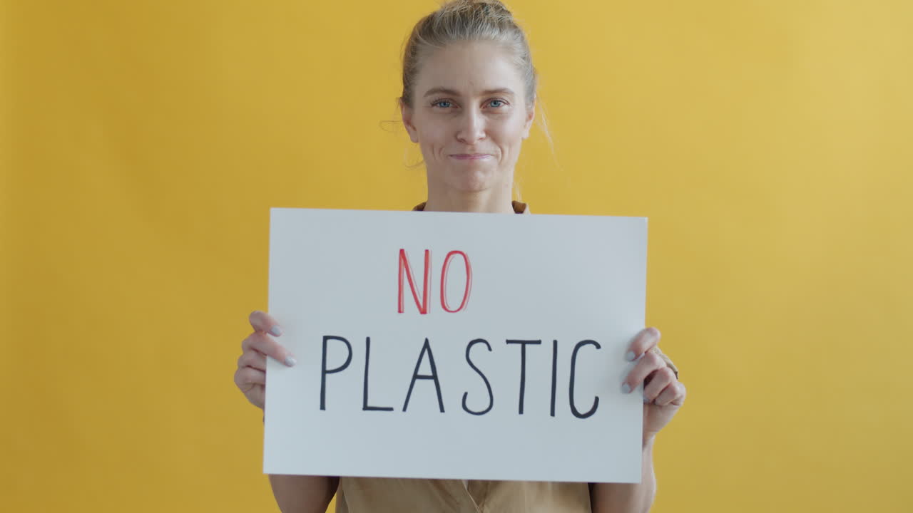Woman Holding Anti-Plastic Sign