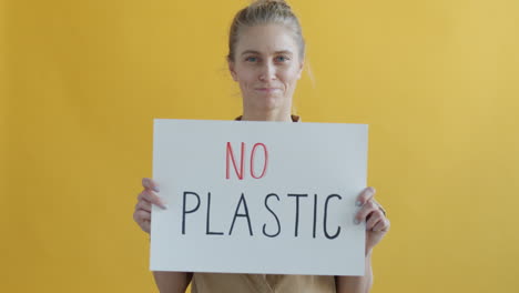 Woman Holding Anti-Plastic Sign