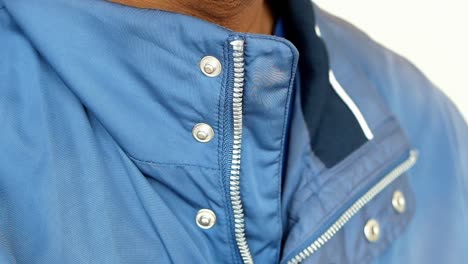 close up of a blue jacket with a zipper