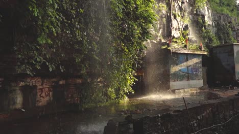 slowmotion shot of a waterfall flowing at a temple of shivpuri madhya pradesh , india