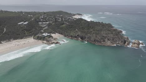 headland park and deadmans headland reserve surrounded with blue ocean - south gorge beach in summer - qld, australia