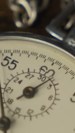 stopwatch on a dark wooden tabl