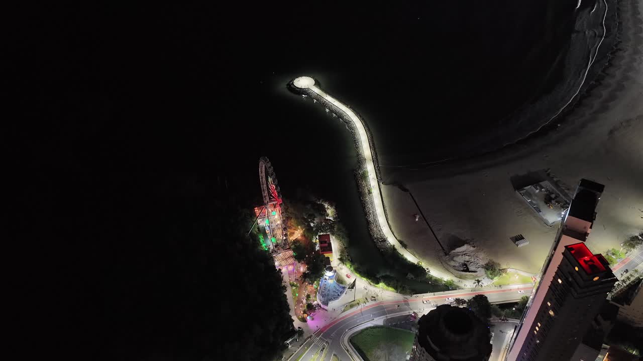 Vibrant Ferris wheel lighting up Balneario Camboriu skyline, premium coastal destination, Santa Catarina, Brazil