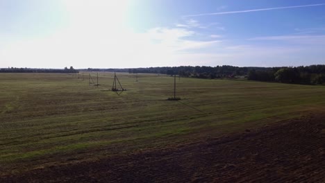 Power-Supply-Pole-Lines-In-Agricultural-Fields-On-a-Sunny-Day