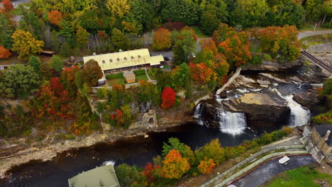 approaching waterfalls in ausable chasm in adirondacks. drone footage above the canyon in new york state, usa in autumn.