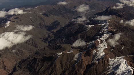 aerial view of snow-capped mountains and valleys