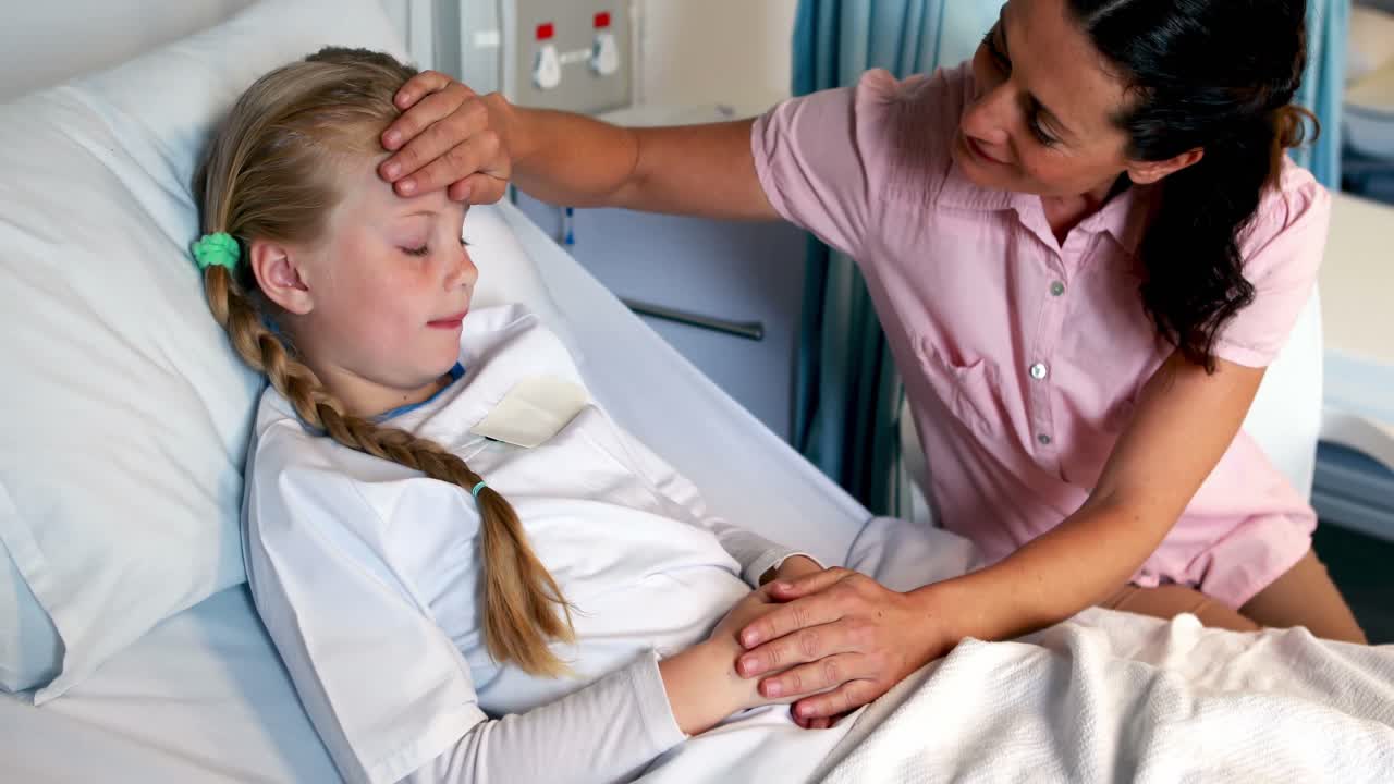 Mother examining her sick daughter