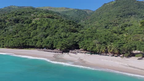 Aerial-view-of-beautiful-Playa-San-Rafael-with-green-mountains-and-sandy-beach-during-sunny-day