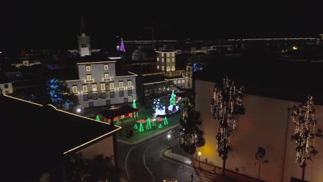 praca do município in old city center of funchal with christmas decorations, aerial